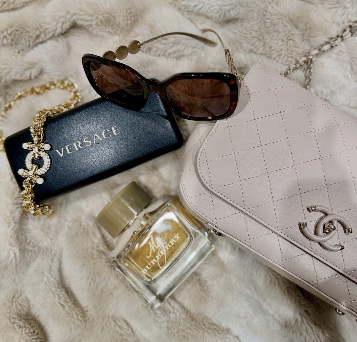 Blush Chanel bag with luxury accessories